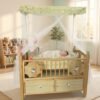 Premium baby wooden cot with mosquito net canopy, bassinet, and storage drawers for newborn babies.