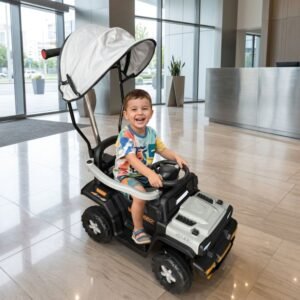 Happy toddler riding a grey kids electric push car with parent handle and canopy at Kids Kart Nepal.